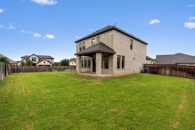 2437 Burberry Ln, Leander, TX 78641 - rear view of property with a fenced backyard, a patio, and stucco siding
