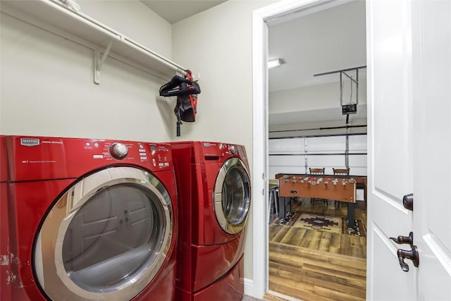 2312 Thornton Rd Unit B, Austin, TX 78704 - laundry room featuring independent washer and dryer, wood finished floors, and a garage