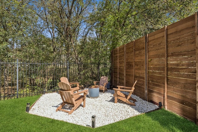 5703 Taunton Dr, Austin, TX 78723 - fenced backyard with an outdoor fire pit