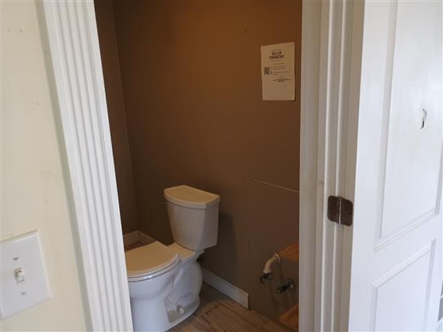 736 W Bell Ave, Rockdale, TX 76567 - bathroom with toilet and baseboards