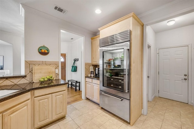 5511 Oakwood Cv Unit B, Austin, TX 78731 - kitchen featuring built in fridge, light brown cabinets, light tile patterned floors, tasteful backsplash, and crown molding