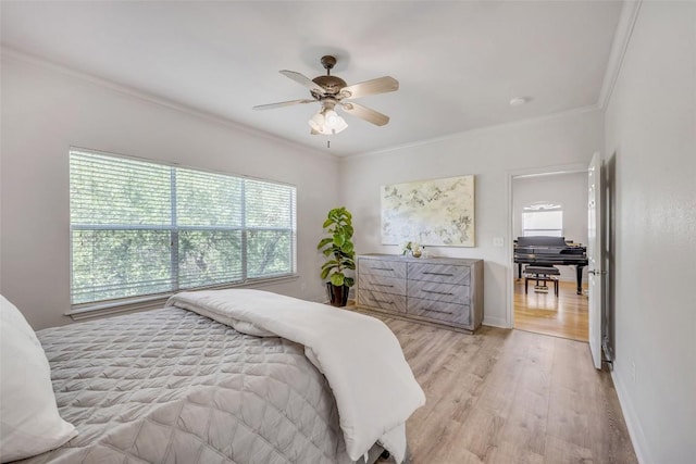 5511 Oakwood Cv Unit B, Austin, TX 78731 - bedroom featuring multiple windows, crown molding, light wood-type flooring, and ceiling fan