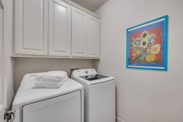 5511 Oakwood Cv Unit B, Austin, TX 78731 - washroom featuring cabinet space and washer and clothes dryer