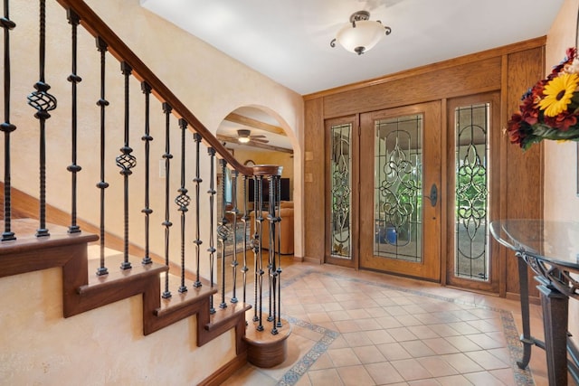 11923 Brookwood Cir, Austin, TX 78750 - tiled foyer entrance featuring inlaid floor details, arched walkways, and stairs