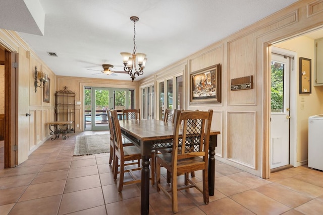 11923 Brookwood Cir, Austin, TX 78750 - dining room featuring a decorative wall, a chandelier, and light tile patterned floors