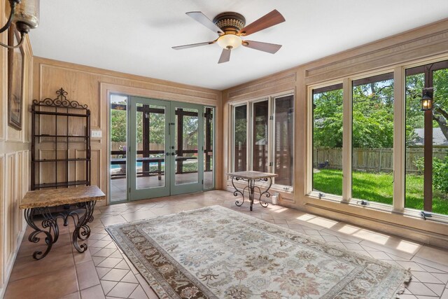 11923 Brookwood Cir, Austin, TX 78750 - doorway to outside with french doors, healthy amount of natural light, tile patterned floors, and wood walls