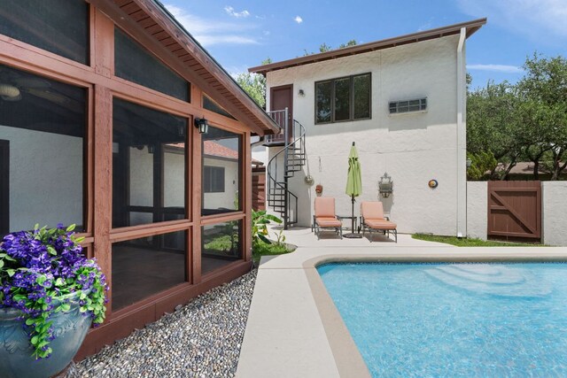 11923 Brookwood Cir, Austin, TX 78750 - view of swimming pool with a patio area, a gate, a sunroom, and stairway