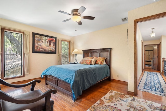 11923 Brookwood Cir, Austin, TX 78750 - bedroom featuring hardwood / wood-style floors and a ceiling fan