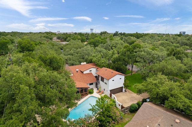 11923 Brookwood Cir, Austin, TX 78750 - drone / aerial view of a heavily wooded area and a pool