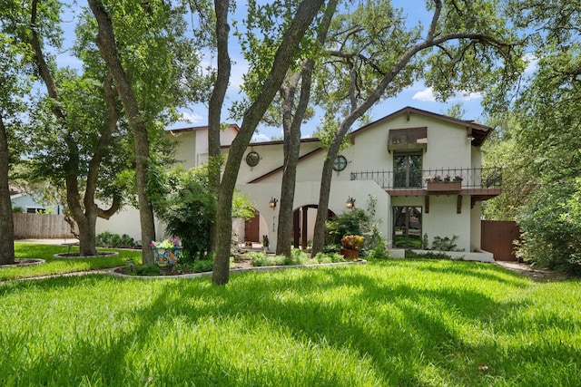 11923 Brookwood Cir, Austin, TX 78750 - view of front of home with stucco siding and a balcony