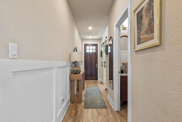 496 Sawtooth Mountain Way, Dripping Springs, TX 78620 - entryway featuring light wood finished floors, a textured wall, and recessed lighting