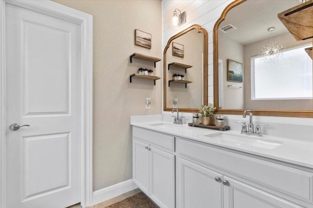 496 Sawtooth Mountain Way, Dripping Springs, TX 78620 - full bath featuring double vanity and baseboards