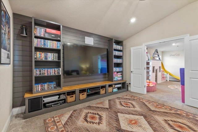 496 Sawtooth Mountain Way, Dripping Springs, TX 78620 - carpeted living room with vaulted ceiling and baseboards