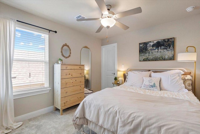 496 Sawtooth Mountain Way, Dripping Springs, TX 78620 - bedroom featuring multiple windows, light colored carpet, and ceiling fan
