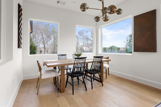 1703 Miami Dr, Austin, TX 78733 - dining room with a chandelier and light wood-style floors