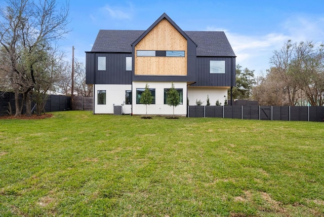 1703 Miami Dr, Austin, TX 78733 - back of property featuring a fenced backyard and roof with shingles