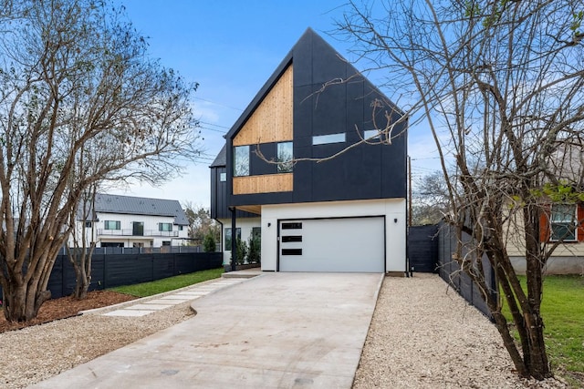 1703 Miami Dr, Austin, TX 78733 - contemporary home with concrete driveway and an attached garage
