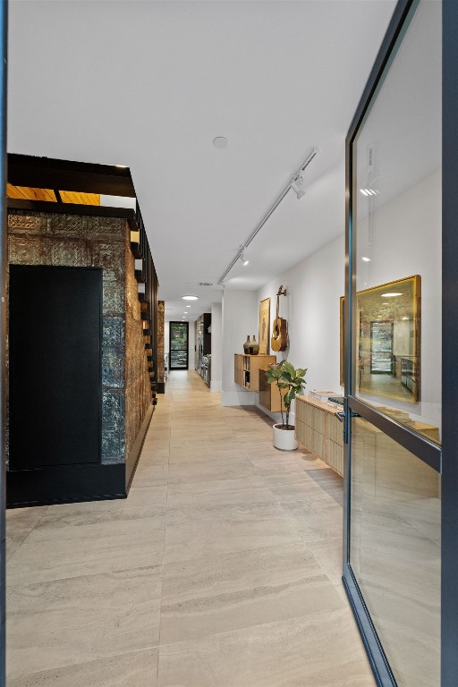 4904 Old Bee Caves Rd, Austin, TX 78746 - hallway with stairs and rail lighting