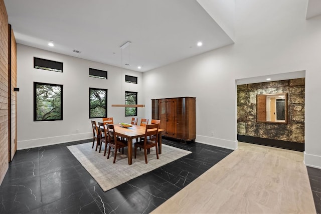 4904 Old Bee Caves Rd, Austin, TX 78746 - dining area featuring recessed lighting, a towering ceiling, and dark marble finish flooring