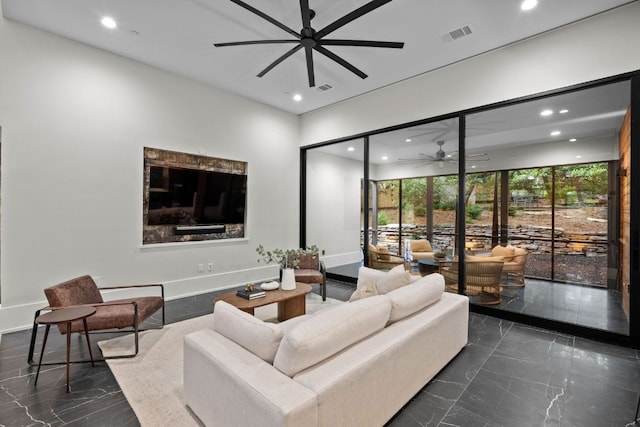 4904 Old Bee Caves Rd, Austin, TX 78746 - living room featuring a ceiling fan, recessed lighting, and dark marble finish floors