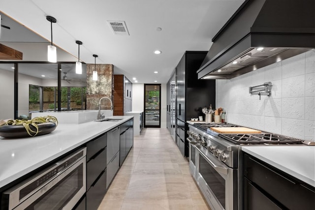 4904 Old Bee Caves Rd, Austin, TX 78746 - kitchen with stainless steel appliances, custom exhaust hood, dark cabinets, modern cabinets, and recessed lighting