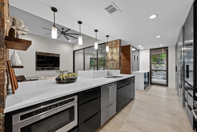 4904 Old Bee Caves Rd, Austin, TX 78746 - kitchen with modern cabinets, stainless steel appliances, pendant lighting, light countertops, and recessed lighting