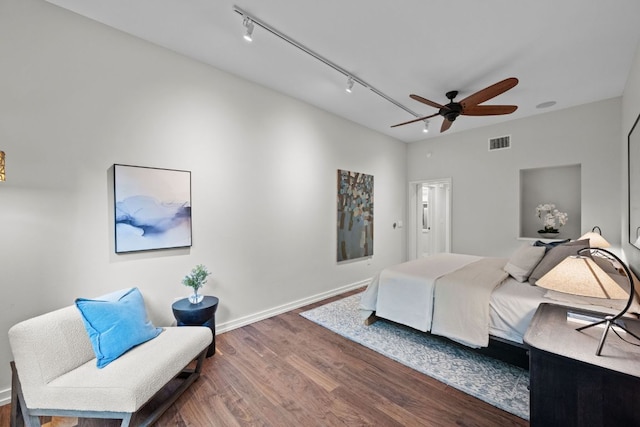 4904 Old Bee Caves Rd, Austin, TX 78746 - bedroom featuring wood finished floors, rail lighting, and a ceiling fan
