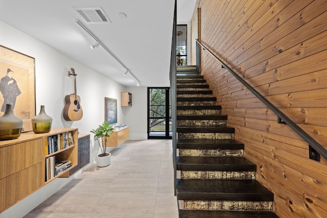 4904 Old Bee Caves Rd, Austin, TX 78746 - staircase featuring track lighting and wood walls