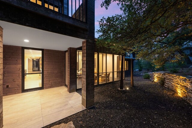 4904 Old Bee Caves Rd, Austin, TX 78746 - property exterior at dusk featuring a patio and a balcony
