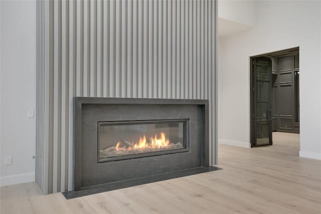 5217 S Scout Island Cir, Austin, TX 78731 - detailed view of wood finished floors and a fireplace with flush hearth