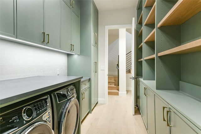 5217 S Scout Island Cir, Austin, TX 78731 - washroom featuring washer and dryer, light wood-style flooring, and cabinet space