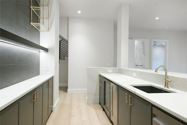 5217 S Scout Island Cir, Austin, TX 78731 - kitchen featuring light wood-style floors, light stone counters, open shelves, recessed lighting, and gray cabinets