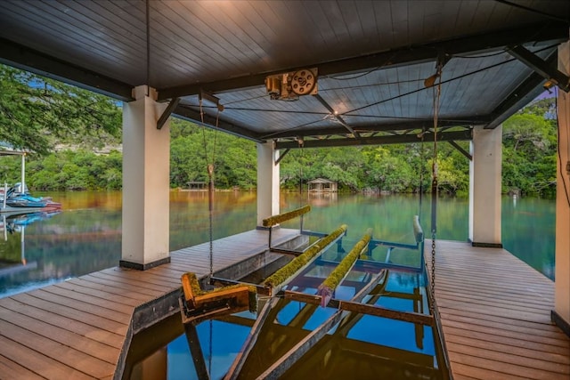 5217 S Scout Island Cir, Austin, TX 78731 - dock area with a water view, boat lift, and view of scattered trees