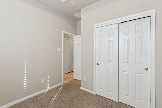 7233 Menchaca Rd Unit 22, Austin, TX 78745 - unfurnished bedroom featuring carpet floors and a closet