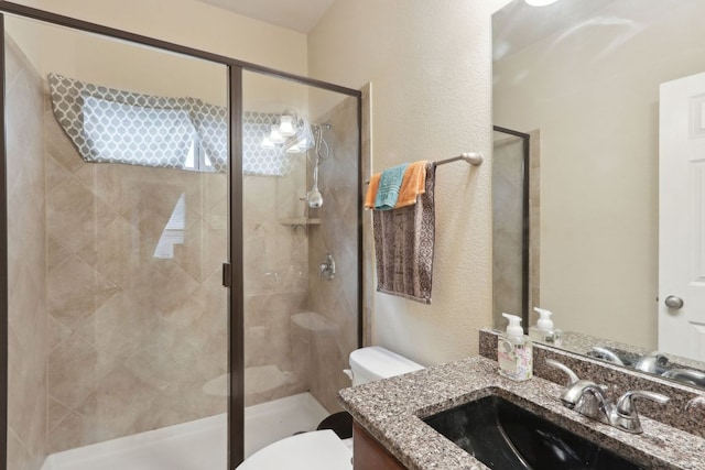 7233 Menchaca Rd Unit 22, Austin, TX 78745 - bathroom featuring vanity, a stall shower, and a textured wall