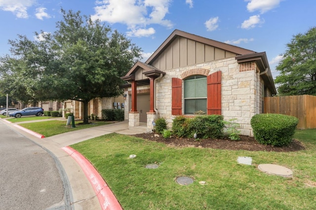 7233 Menchaca Rd Unit 22, Austin, TX 78745 - view of front facade with stone siding and board and batten siding