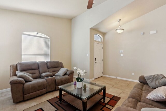 7233 Menchaca Rd Unit 22, Austin, TX 78745 - living area with light tile patterned floors and a ceiling fan