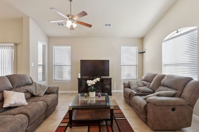 7233 Menchaca Rd Unit 22, Austin, TX 78745 - living room featuring ceiling fan, light tile patterned floors, and lofted ceiling
