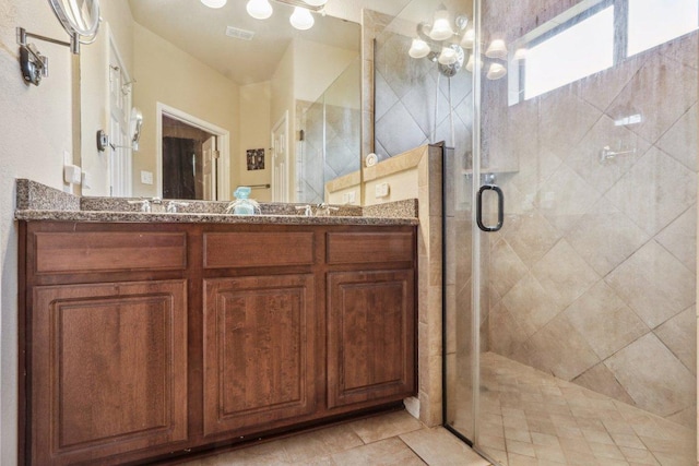 7233 Menchaca Rd Unit 22, Austin, TX 78745 - bathroom with vanity, a shower stall, and a chandelier
