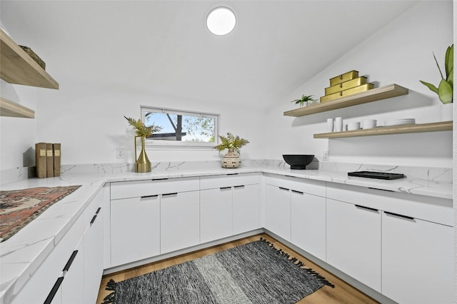 2114 Vanderbilt Ln, Austin, TX 78723 - kitchen with open shelves, white cabinets, lofted ceiling, and wood finished floors