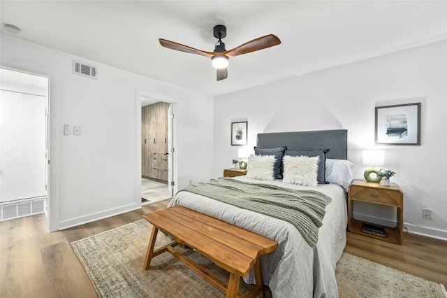 2114 Vanderbilt Ln, Austin, TX 78723 - bedroom with wood finished floors and a ceiling fan