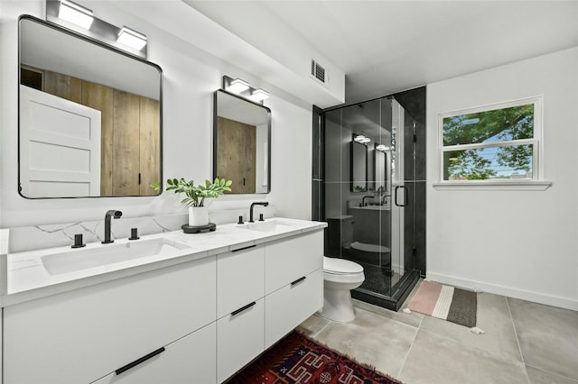 2114 Vanderbilt Ln, Austin, TX 78723 - bathroom with double vanity, a shower stall, and tile patterned floors