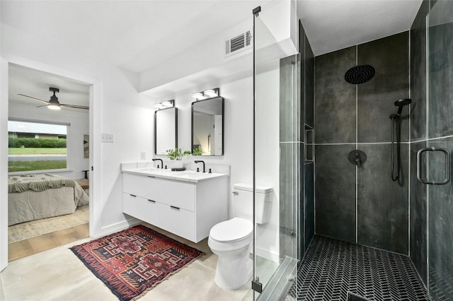 2114 Vanderbilt Ln, Austin, TX 78723 - full bath with connected bathroom, double vanity, a shower stall, a ceiling fan, and wood finished floors