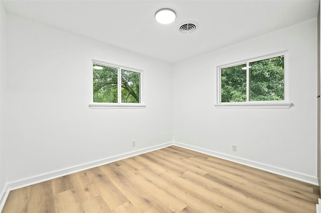 2114 Vanderbilt Ln, Austin, TX 78723 - unfurnished room with baseboards and light wood-style floors