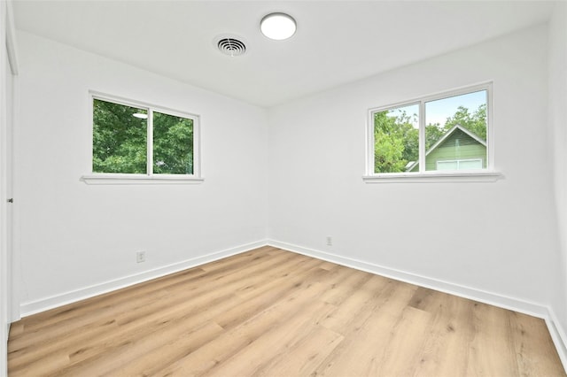 2114 Vanderbilt Ln, Austin, TX 78723 - unfurnished room with baseboards and light wood-style floors