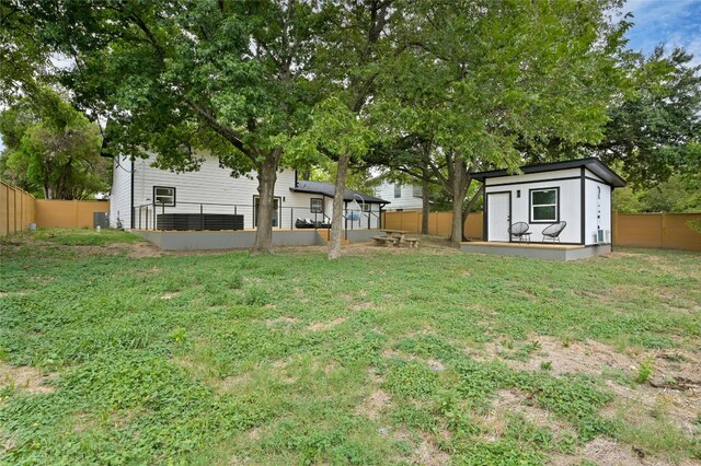 2114 Vanderbilt Ln, Austin, TX 78723 - fenced backyard featuring a shed