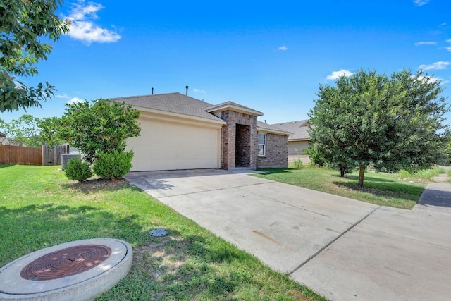 608 Silver Wing Dr, Austin, TX 78725 - view of front of house with brick siding, driveway, an attached garage, and a shingled roof