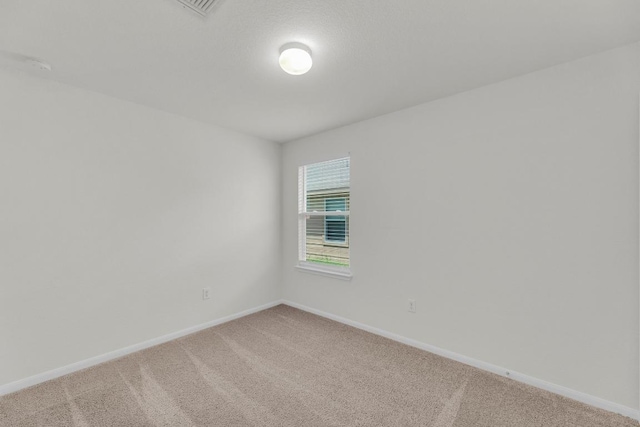 608 Silver Wing Dr, Austin, TX 78725 - spare room with light colored carpet and a smoke detector