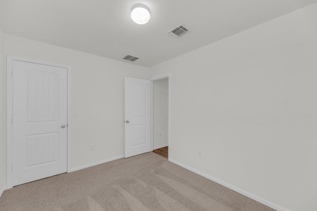 608 Silver Wing Dr, Austin, TX 78725 - unfurnished bedroom with carpet flooring and baseboards