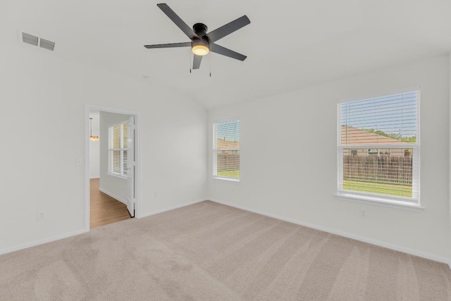 608 Silver Wing Dr, Austin, TX 78725 - spare room with carpet, a ceiling fan, and lofted ceiling